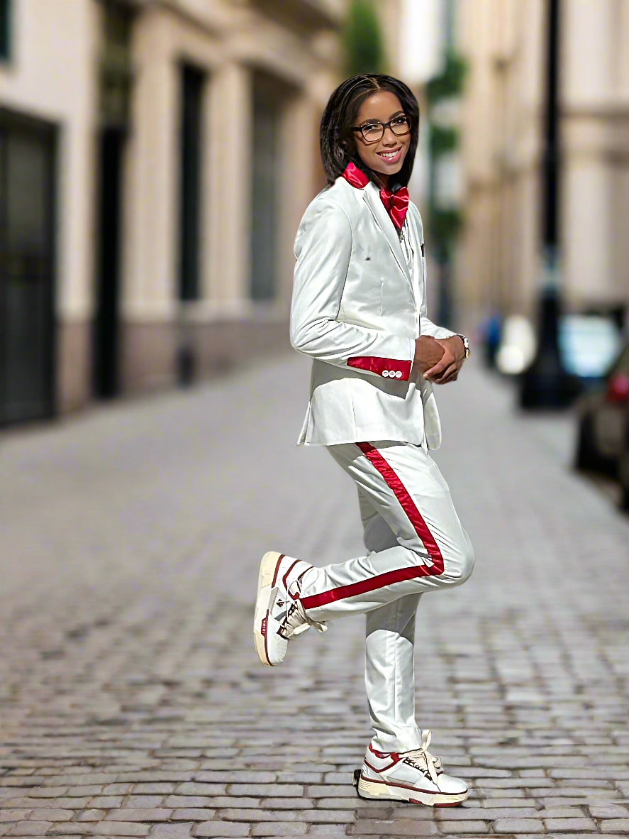 Woman wearing white suit with red stripe